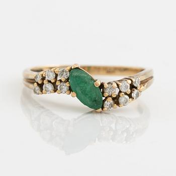 18K gold, navette shaped emerald and brilliant cut diamond ring.