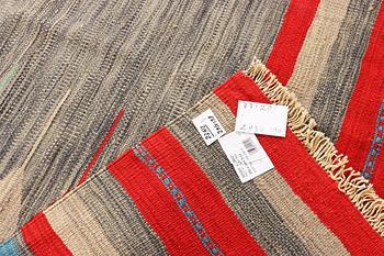 An Afghan Kilim carpet, c. 293 x 199 cm.