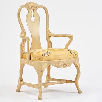 A rococo open armchair in the manner of C M Sandberg, Stockholm, later part 18th century.