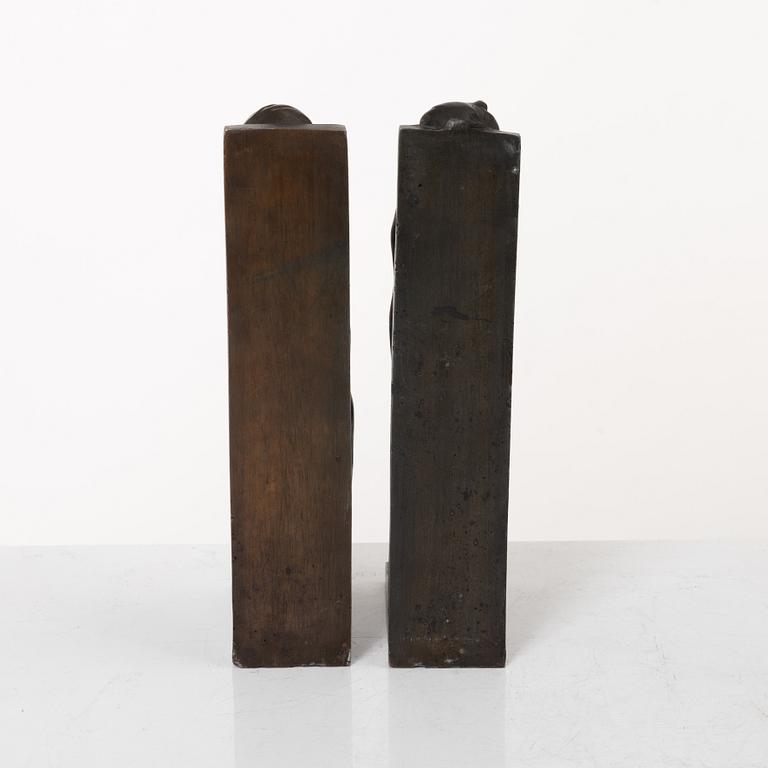 Axel Gute, two patinated metal bookends.