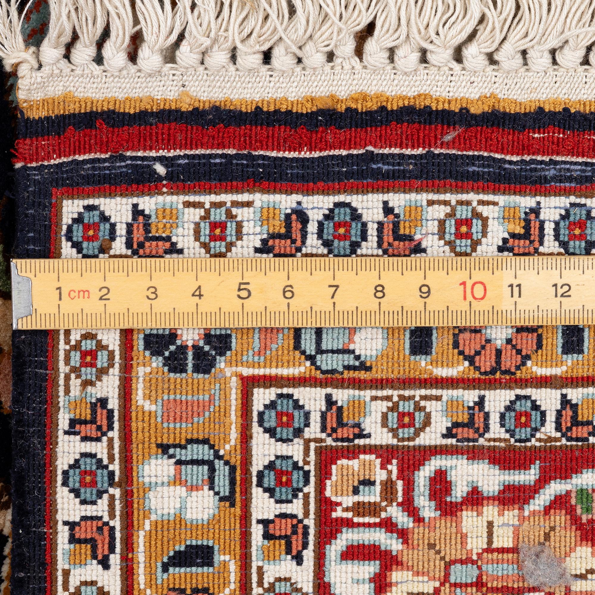 A Kashmir silk rug, c. 168 × 102 cm.