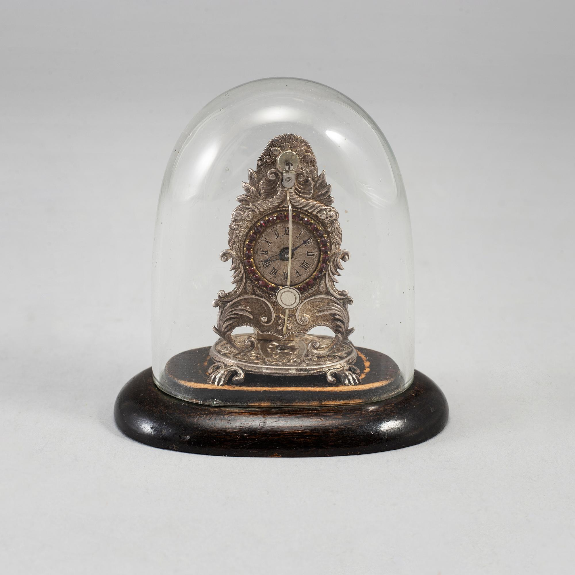 A 19th century miniature silver mantle clock.
