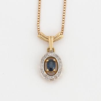 An 18K gold chain and pendant set with an oval, mixed-cut, synthetic sapphire surrounded by eight-cut diamonds.