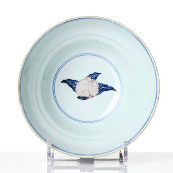 A blue and white and copper-red 'peaches' bowl, Qing dynasty.