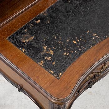 A mahogany veneered desk, mid 20th Century.