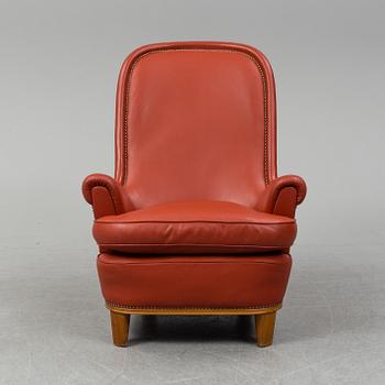 A 1930's leather upholstered 'Paris' lounge chair by Carl Axel Acking.