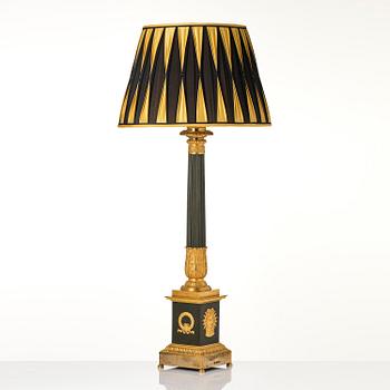 A French late Empire ormolu and patinated bronze lamp, first part 19th century.