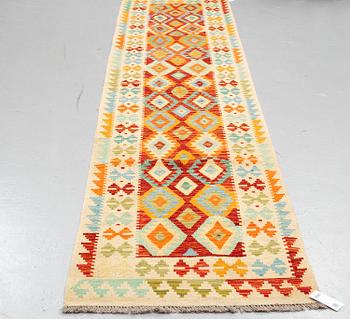 A kilim runner, ca 393 x 80 cm.