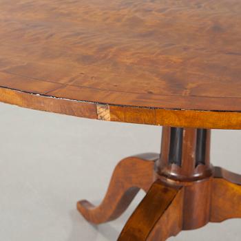 A 19th century drop-leaf table.