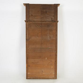 An Empire mirror, first half of the 19th Century.