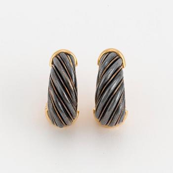 A pair of Cartier hoop earrings.