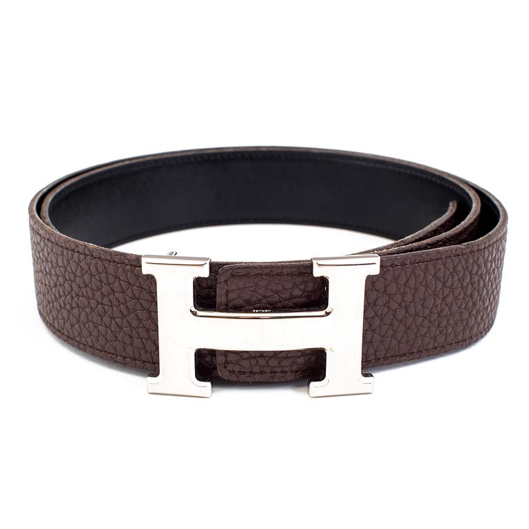 Brown togo belt "Constance" by Hermès.