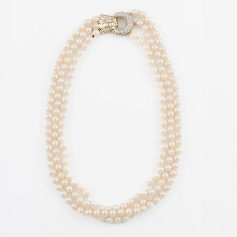 Pearl necklace, three strands of cultured pearls, clasp in 18K gold set with baguette and brilliant-cut diamonds.