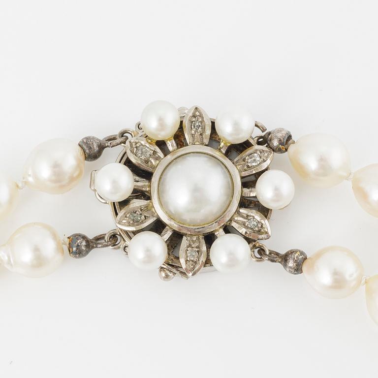Necklace, cultured pearls, clasp 18K gold with cultured pearls and diamonds, JSG, Jönköping 1979.