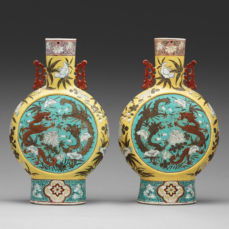 A pair of famille rose vases, Qing dynasty, late 19th Century.