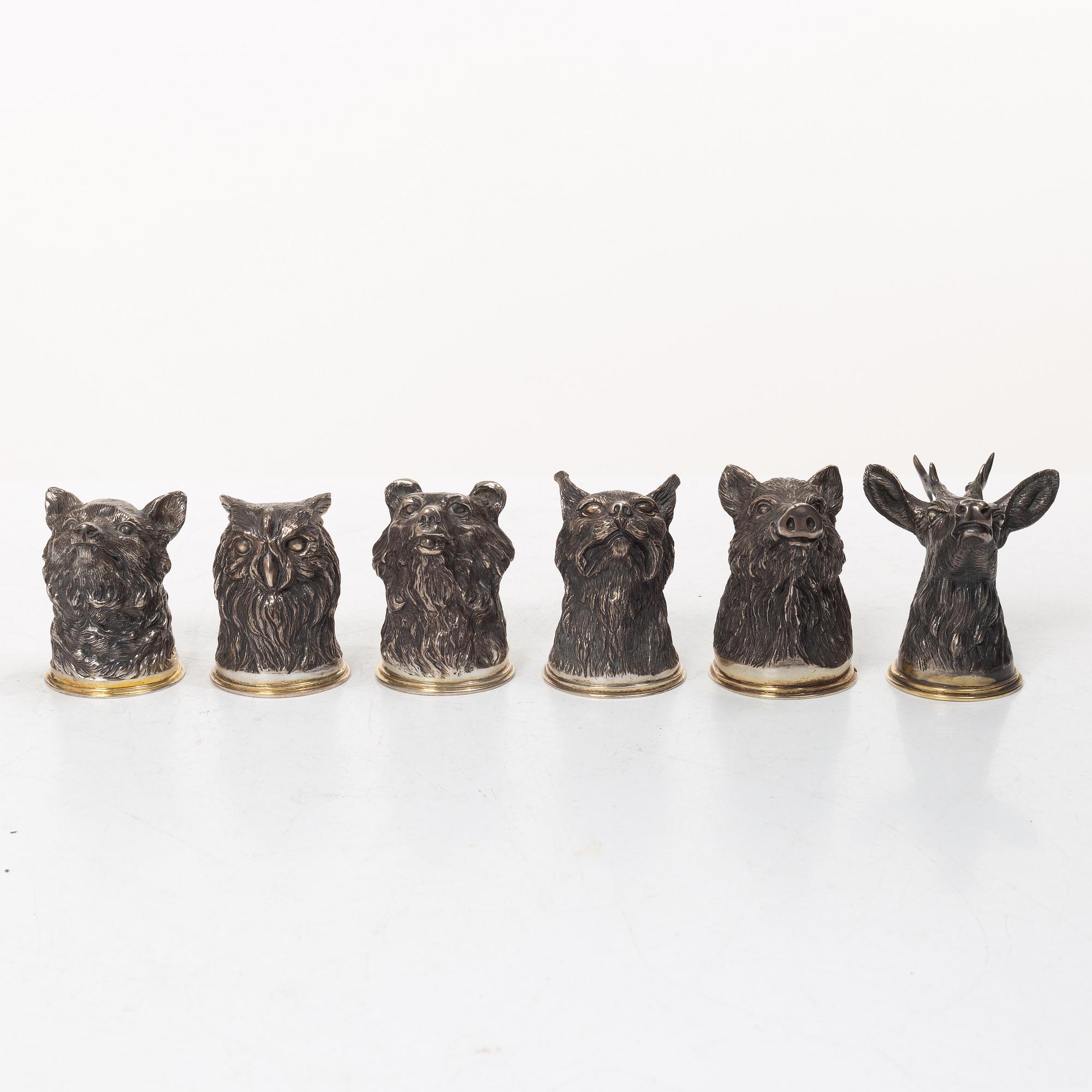 Six Russian parcel-gilt silver animal's head stirrup cups, including with mark of Nikols & Plinke, St. Petersburg.