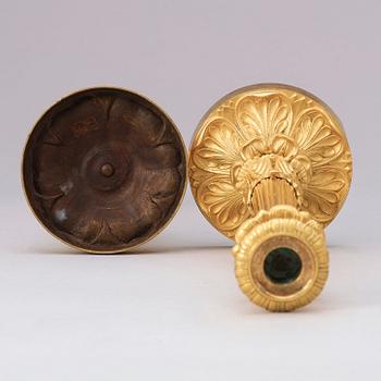 A pair of late Empire 19th century gilt bronze candlesticks.