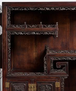 A pair of Chinese hardwood display cabinets, Qing dynasty, 19th Century.