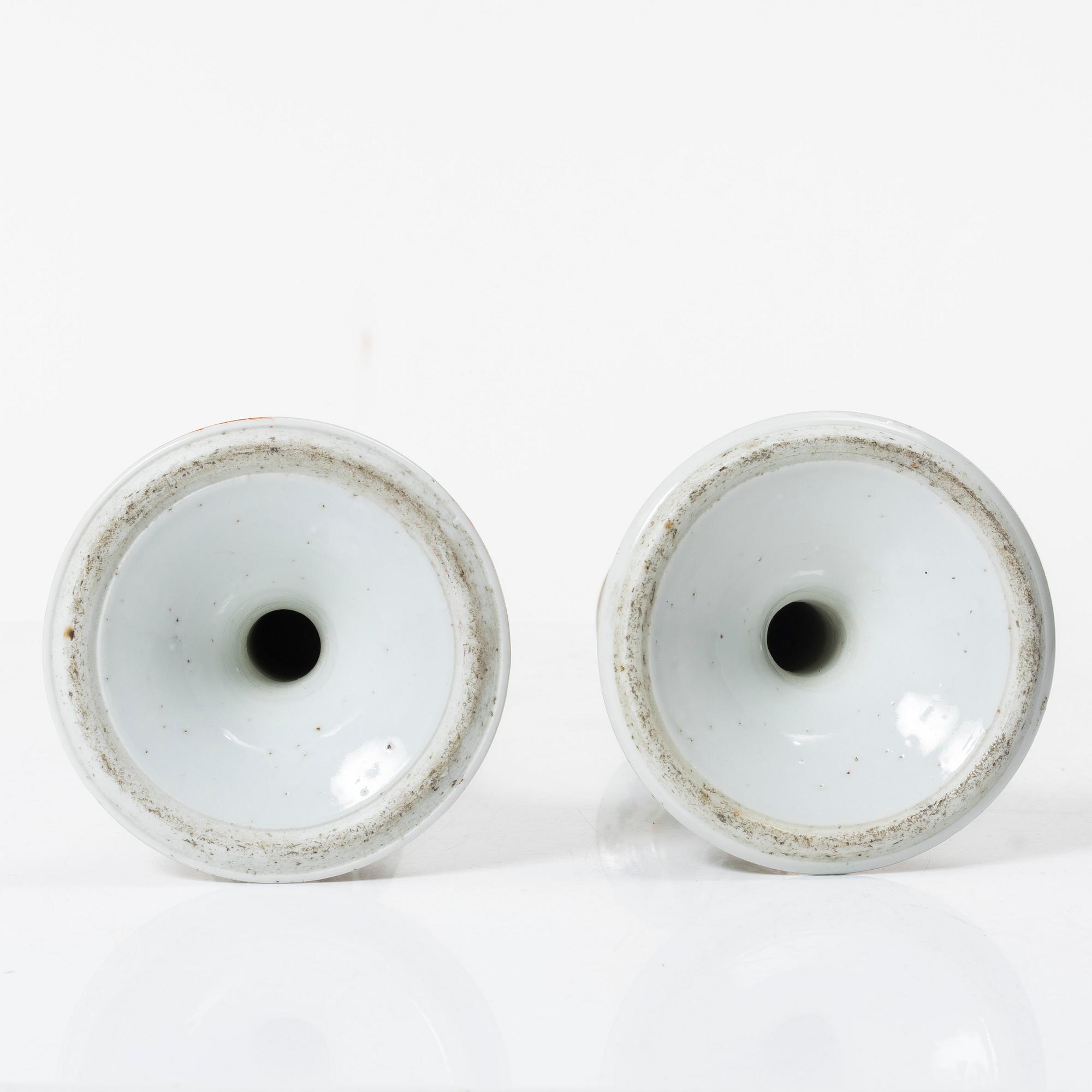 A pair of famille rose Canton candle sticks, Qing dynasty, 19th century.