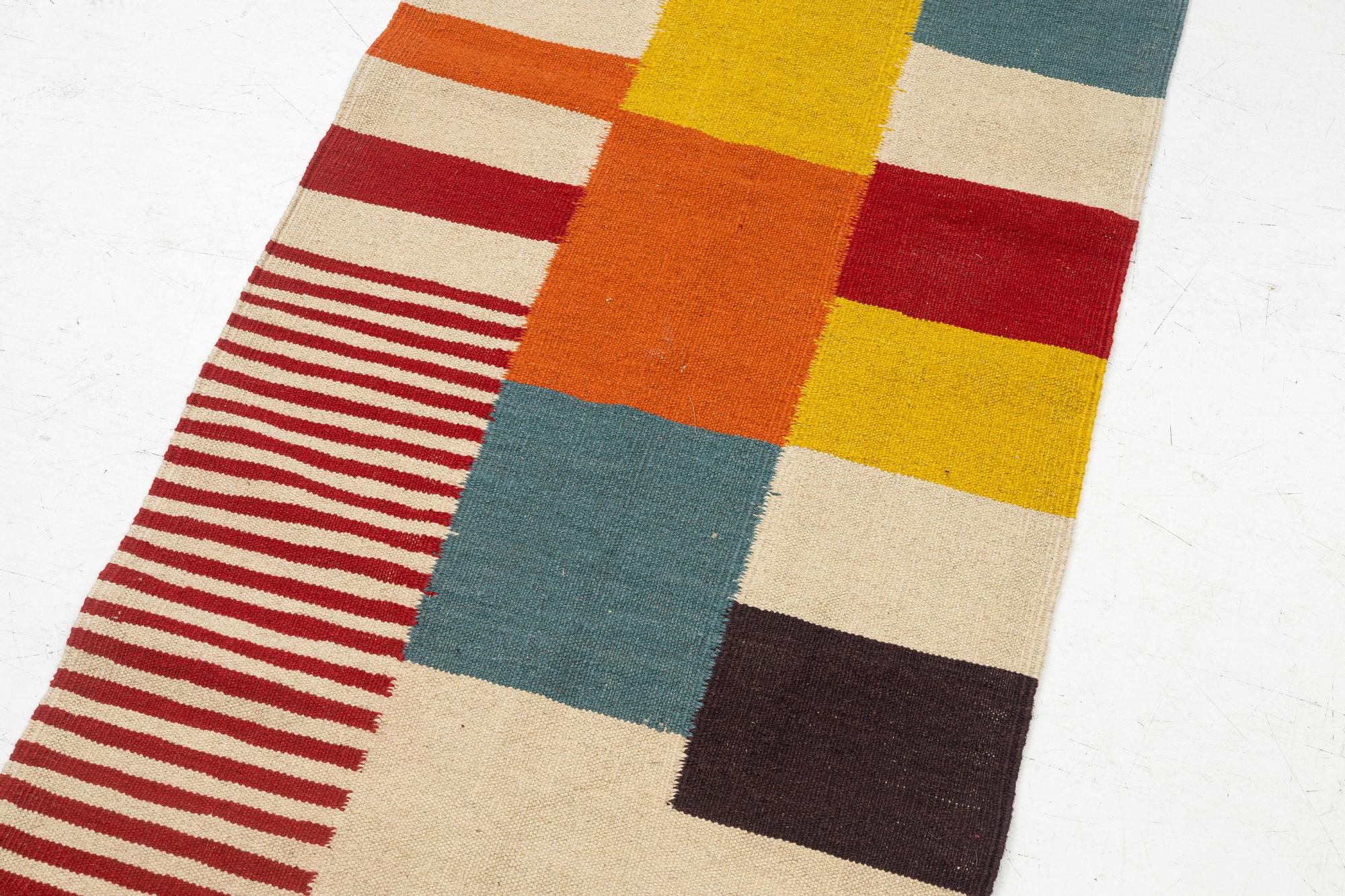 A Kilim runner, c. 295 x 80 cm.