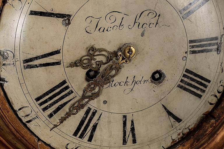 A Gustavian wall hanged clock, dial marked "Jacob Kock Stockholm", maded in the second half of the 18th century.