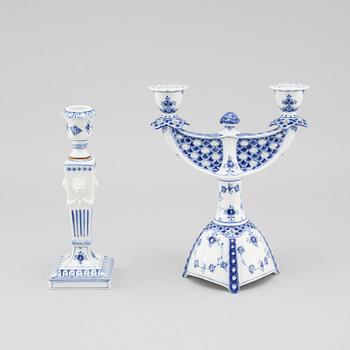 A porcelain candelabra and a candlestick from Royal Copenhagen, model "Musselmalet", 20th century.