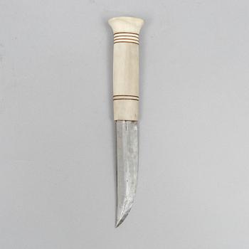 Esse Poggats, a reindeer horn knife, signed.