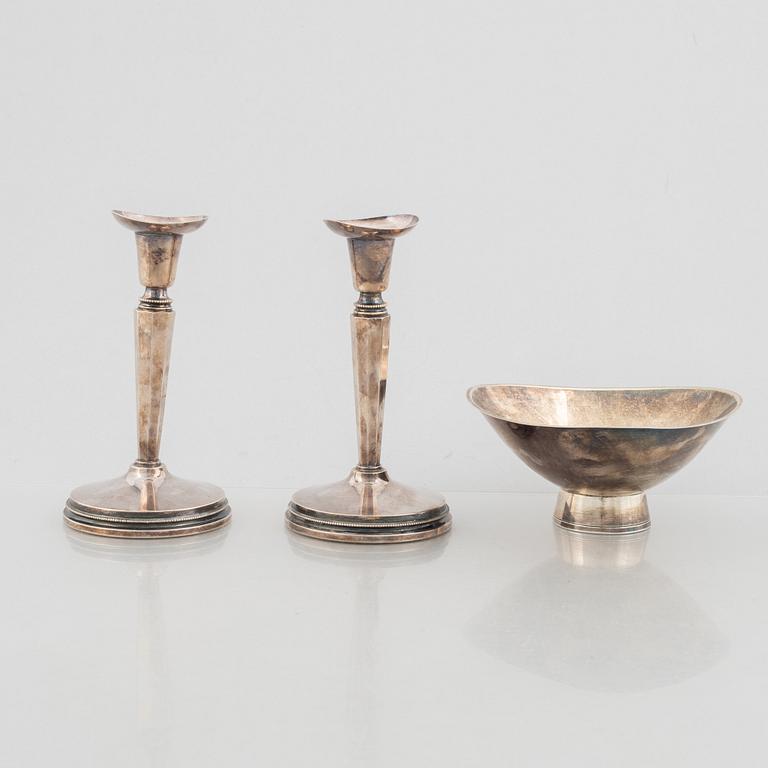 A pair of silver candlesticks, MGAB, Uppsala, Sweden, 1973, and a silver bowl by Gustaf Janson, CGH, Sweden, 1959.