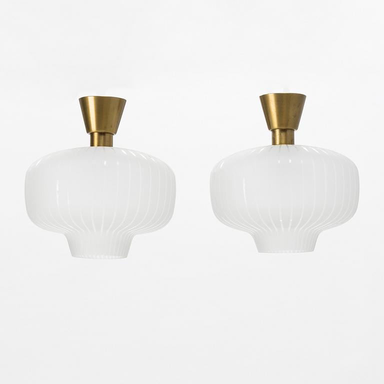 A pair of glass and brass Swedish Modern ceiling lights, Böhlmarks, 1940's.