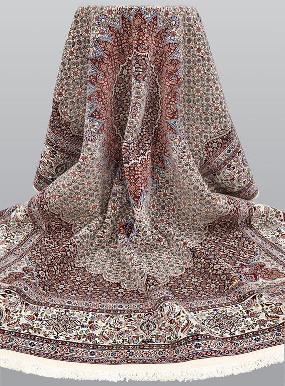 A part silk Moud carpet, approximately 350 x 252 cm.