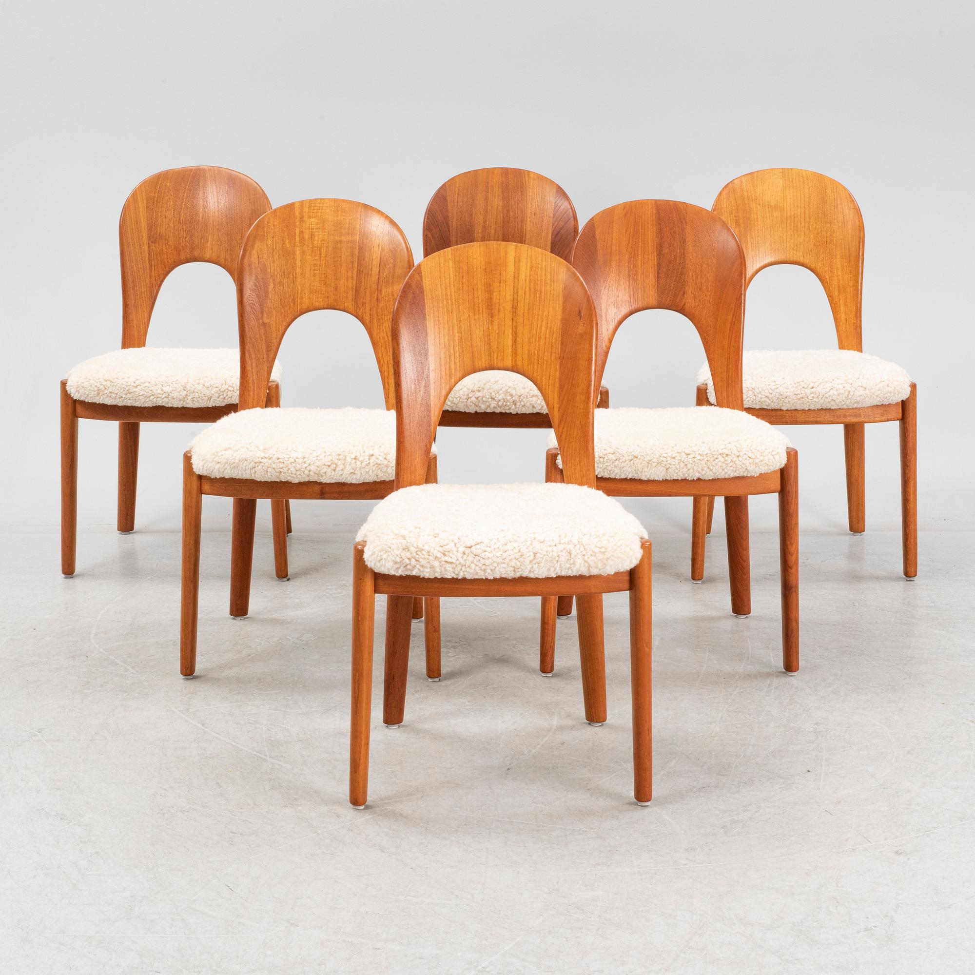 A set of six teak dining chairs upholstered in new sheep skin by Niels Koefoed, Denmark, 1960's.