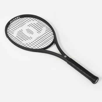 Chanel, tennis racket and 4 balls with case.