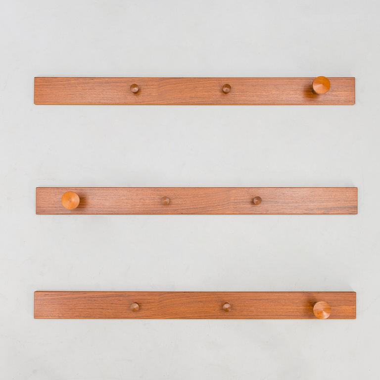 A set of three No. 140 wall coat hangers with manufacturer's mark.