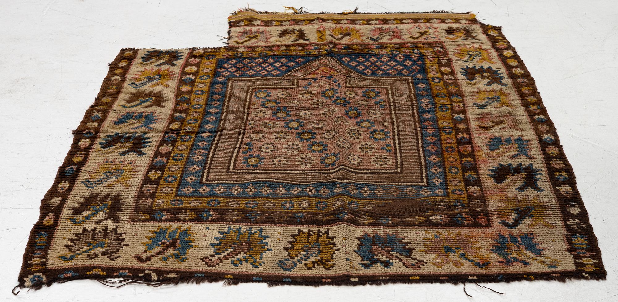 An antique Monastir prayer rug fragment , Ottoman Empire, c 133 x 106 cm.