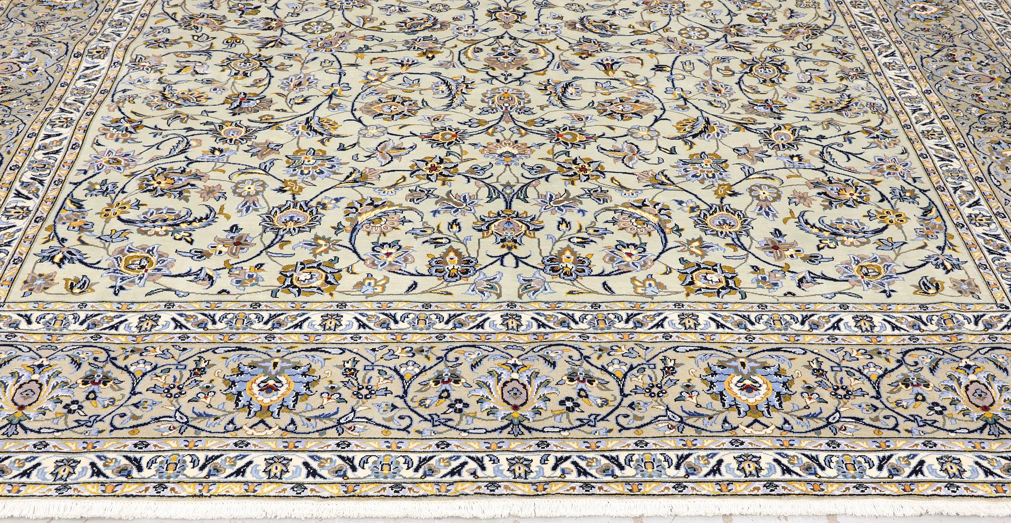 A Keshan carpet, signed, 397 x 302 cm.
