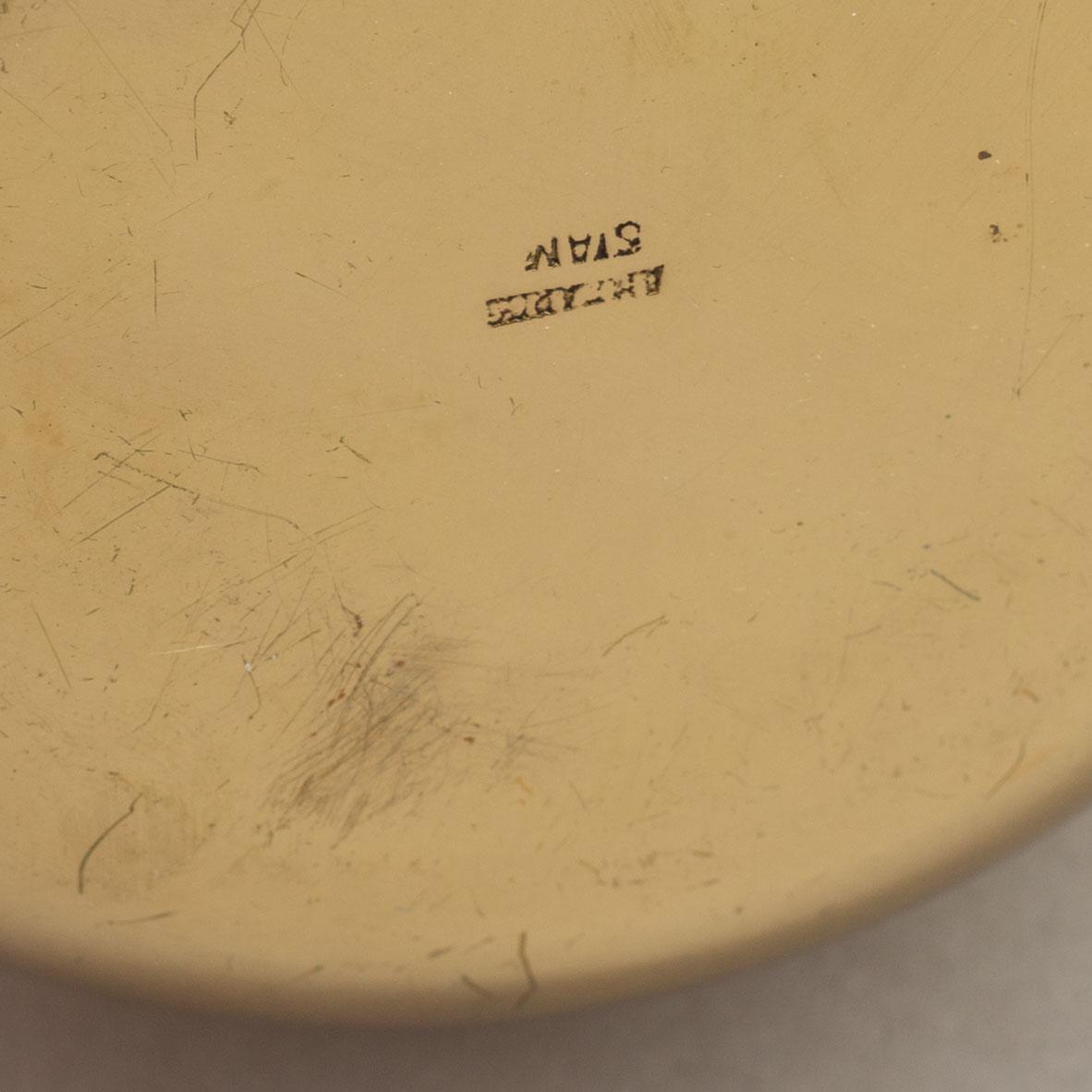 A set of eight polished brass pomme granate shaped jars with covers on stands, Marked Siam, Amfar Co.