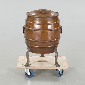 A copper water container, around the year 1900.