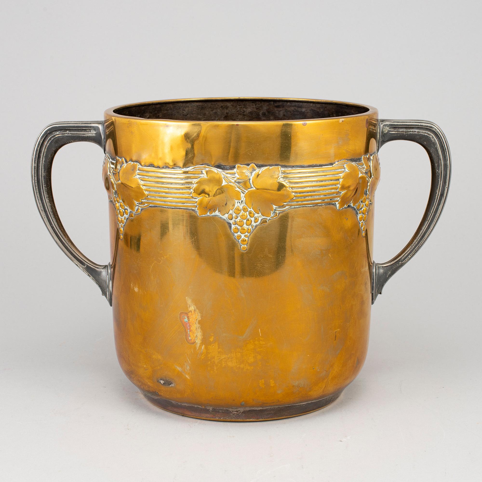 An art nouveau brass champagne cooler, early 20th century.