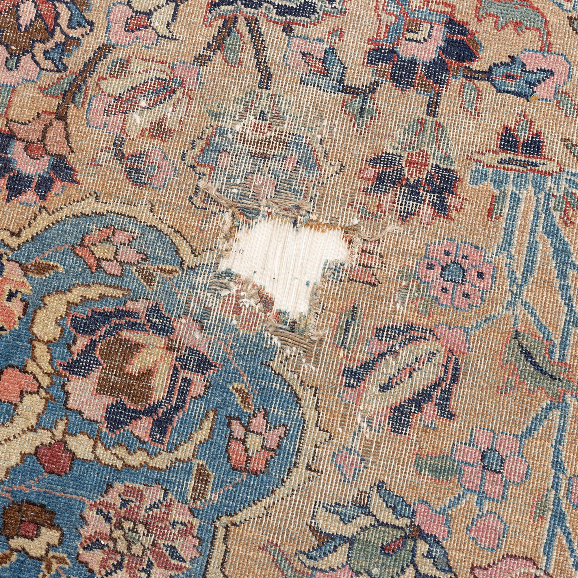 An oriental carpet, circa 350 x 295 cm.