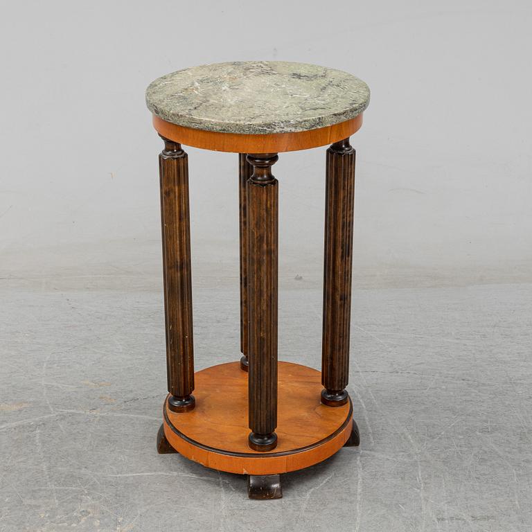 A stone top pedestal, 1920's/30's.