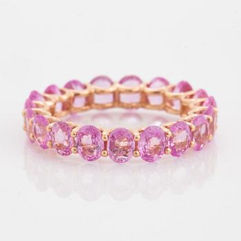 Oval faceted pink sapphire ring.
