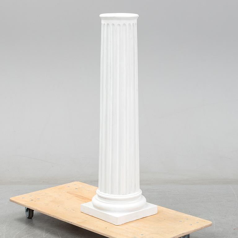 A plaster bust and pedestal.