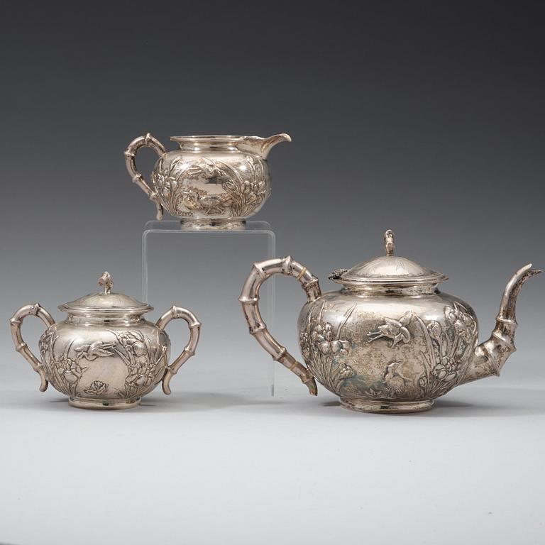 A three piece export silver tea service, Shanghai, early 20th Century.