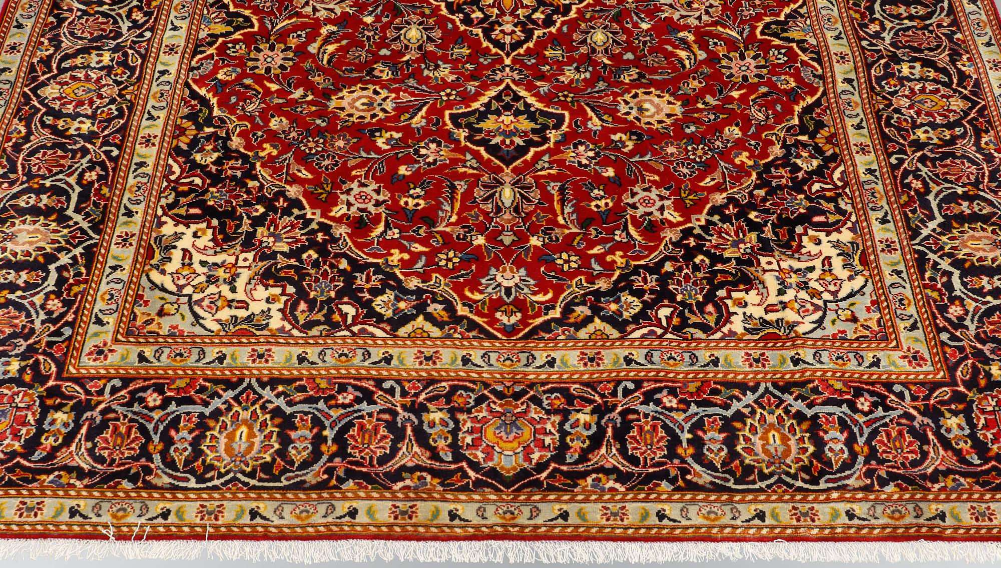 A carpet, Kashan, signed, ca 300 x 204 cm.