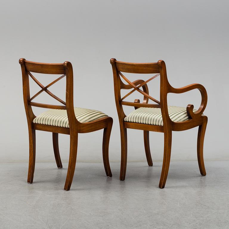 A late 20th century English style dining table and six chairs.