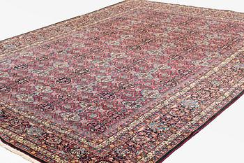 A carpet, semi-antique, Semnan, ca 412 x 304 cm.