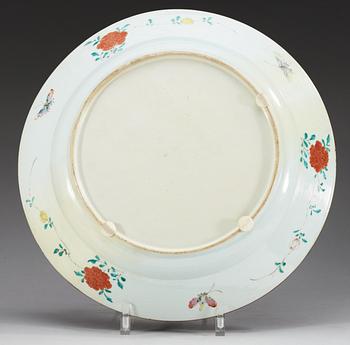 A large famille rose 'Euroepan subject' charger, Qing dynasty, ca 1740.