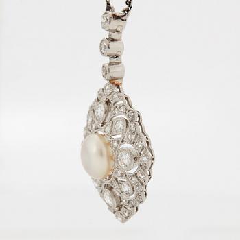 A platinum pendant set with a bouton pearl and old- and rose-cut diamonds.