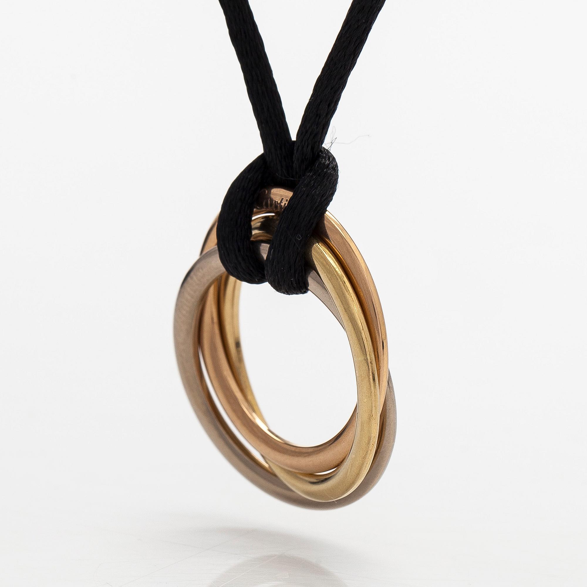 Cartier, necklace/pendant, "Trinity", 18K tricolour gold with black silk cord.