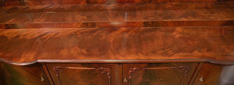 A 1920s Chippendale style buffet sideboard.